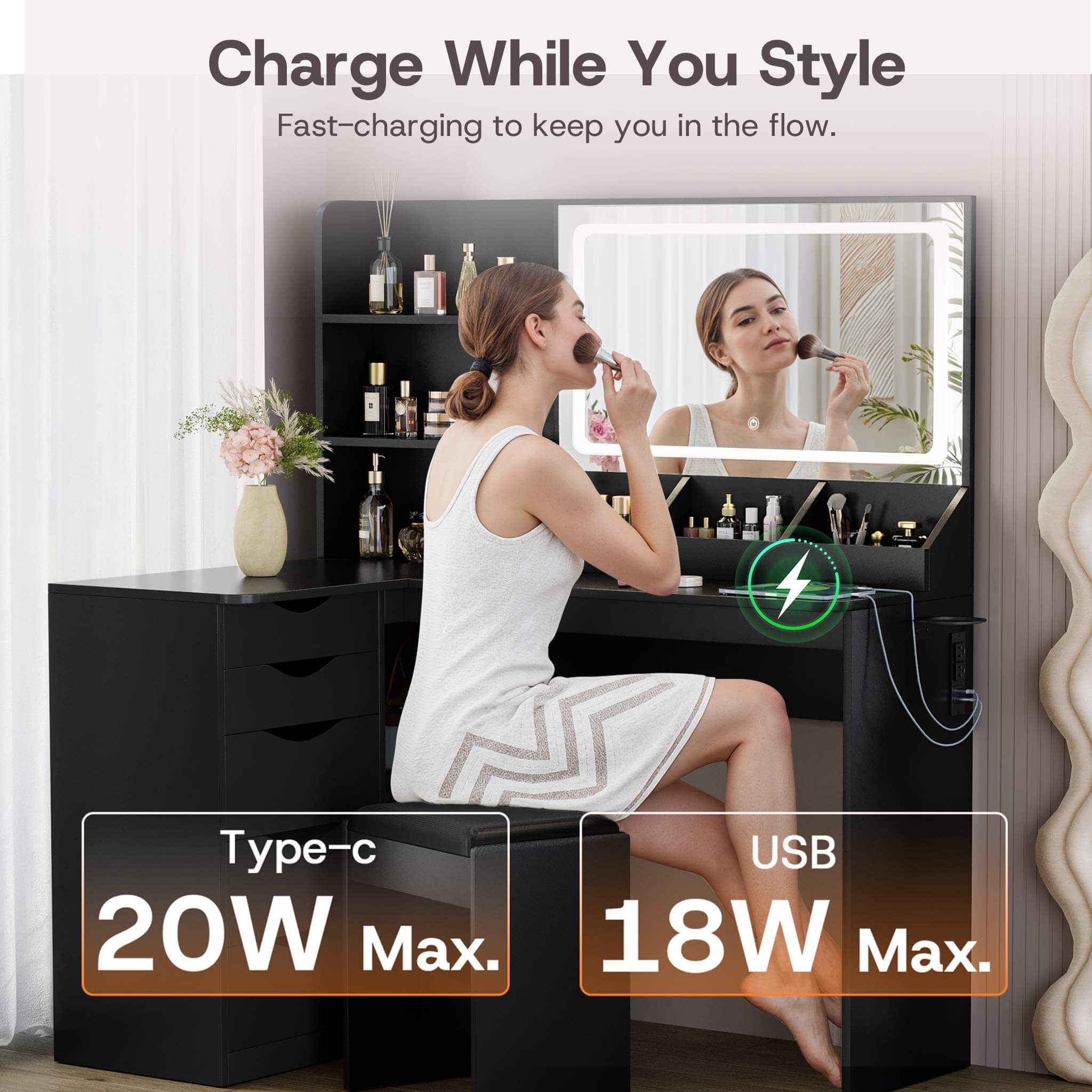 Woman styling hair at Black Treevan Corner Studio vanity featuring fast-charging USB and Type-C ports.