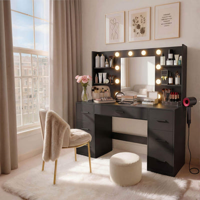 Black Treevan Aura Vanity set with lighted mirror placed in a cozy bedroom setting.