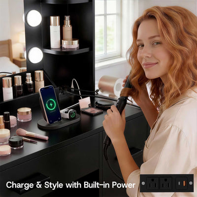 Woman styling hair at Black Treevan Aura Plus Vanity featuring built-in power outlets and USB ports.