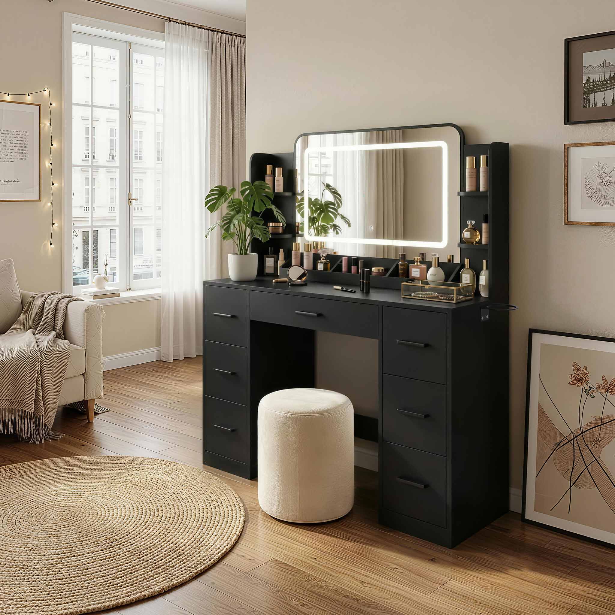 Black Treevan Aura Studio Vanity set with LED mirror placed in a modern bedroom setting.