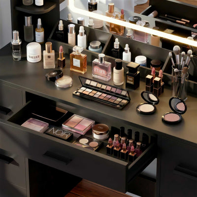 Close-up view of Black Treevan Aura Studio Vanity drawer storage space organized with beauty essentials.