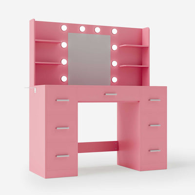 Light Pink Treevan Aura Vanity table featuring a large mirror with Hollywood-style bulbs and multiple storage shelves.