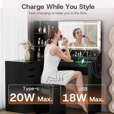 Woman styling hair at Black Treevan Corner Studio vanity featuring fast-charging USB and Type-C ports.