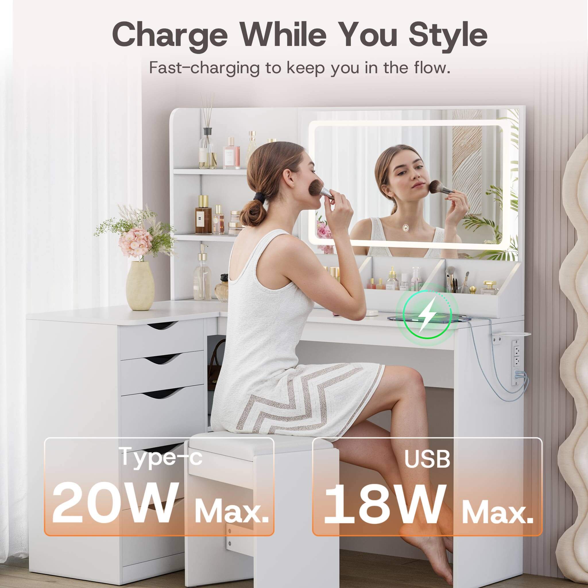 Woman styling hair at White Treevan Corner Studio vanity featuring fast-charging USB and Type-C ports.