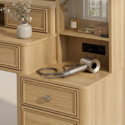Built-in power strip with AC outlets and USB ports on the Oak Treevan Gallery Grand vanity desk for easy styling.