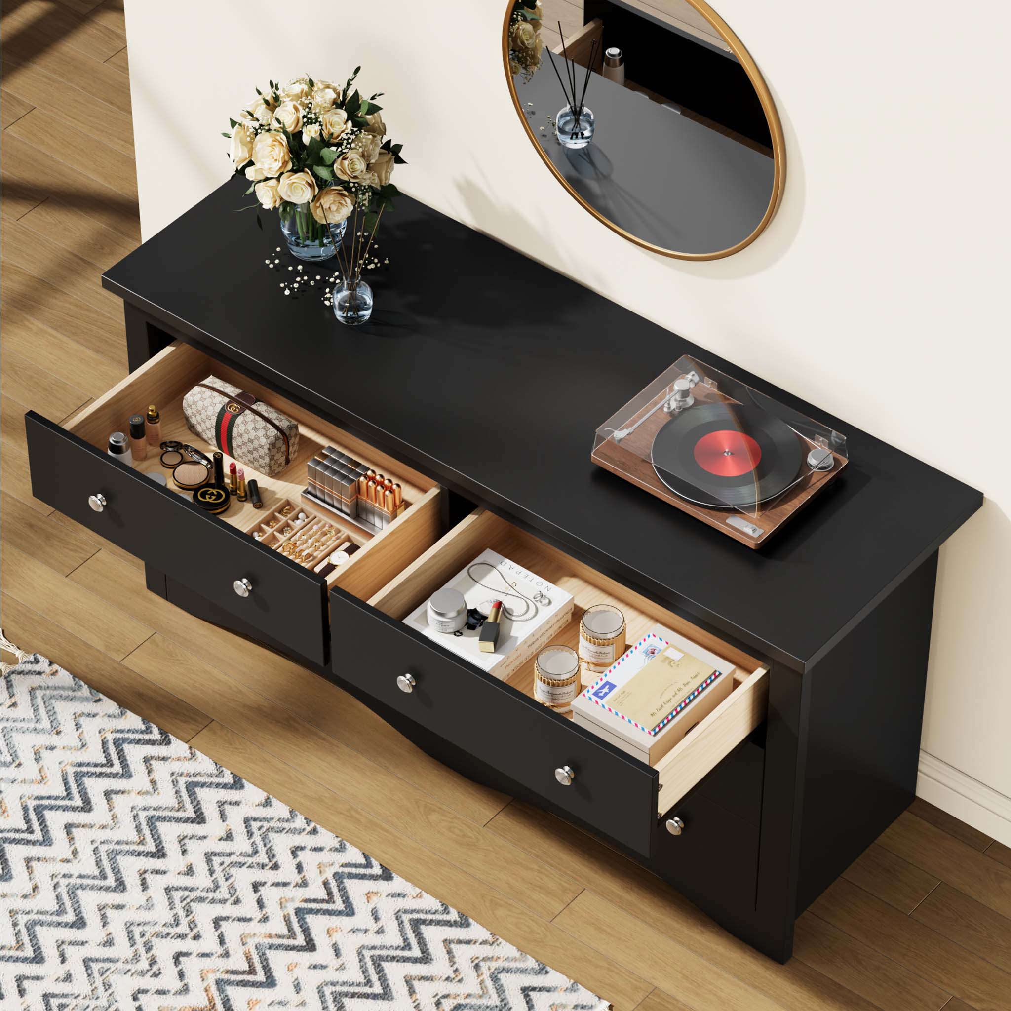 Top view of open drawers in the Black Treevan Hestia double dresser showcasing spacious storage for a record player, cosmetics, and daily essentials.
