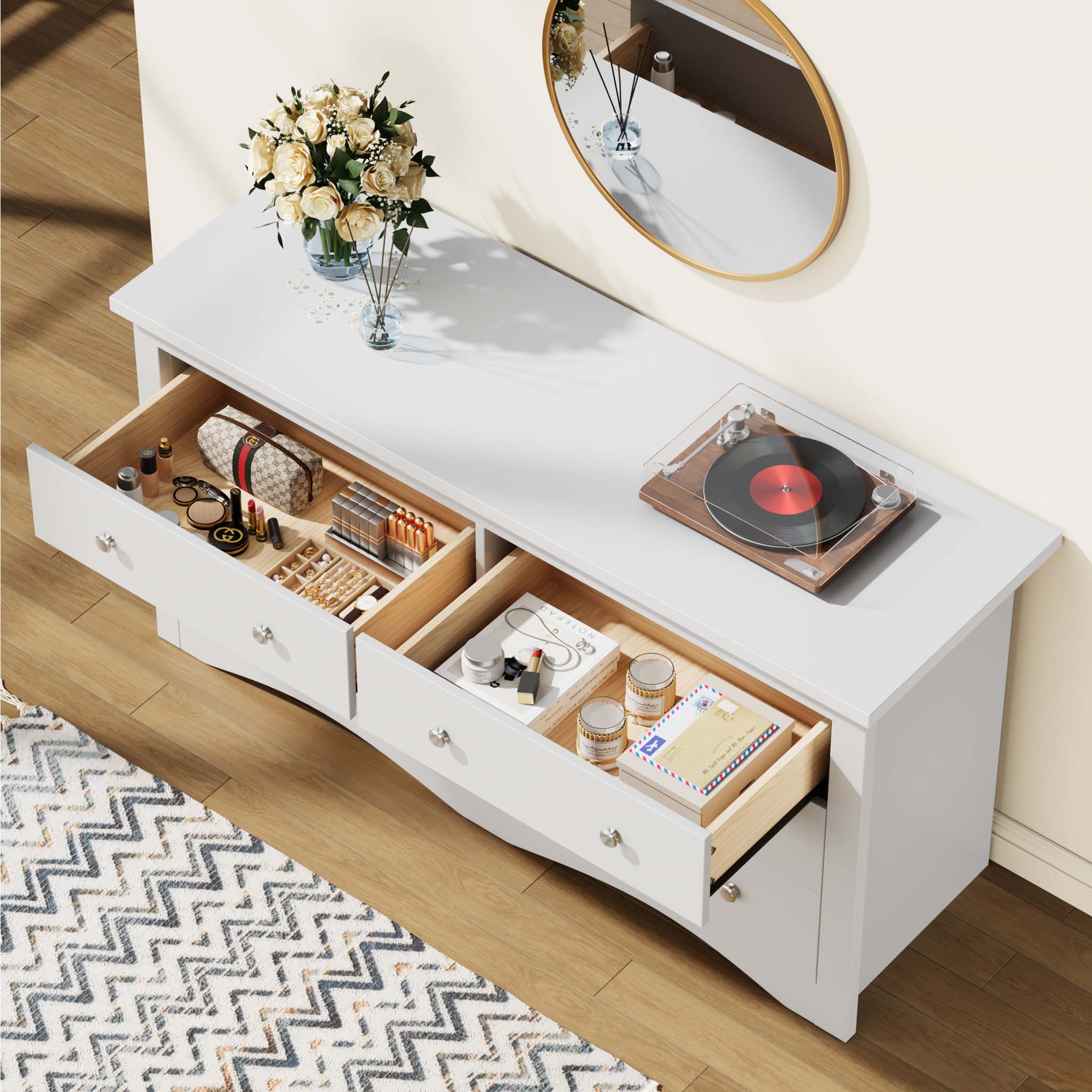Top view of open drawers in the White Treevan Hestia double dresser showcasing spacious storage for a record player, cosmetics, and daily essentials.