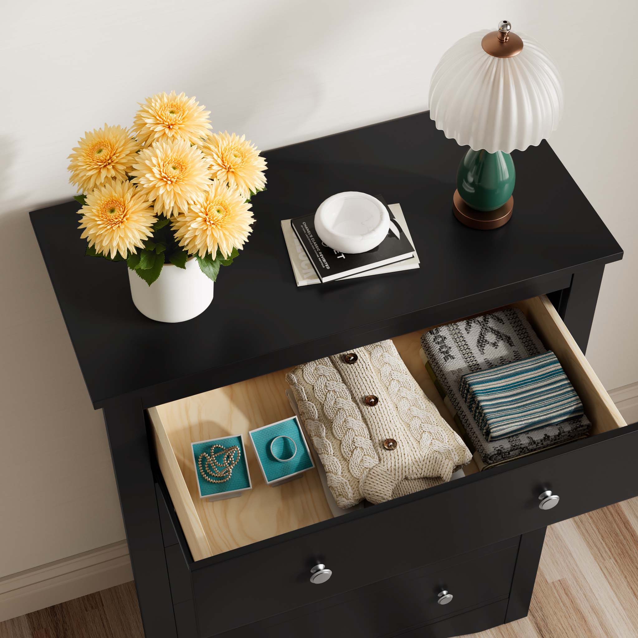 Top view of an open drawer in the Black Treevan Hestia tall chest showing spacious storage for clothes and accessories.