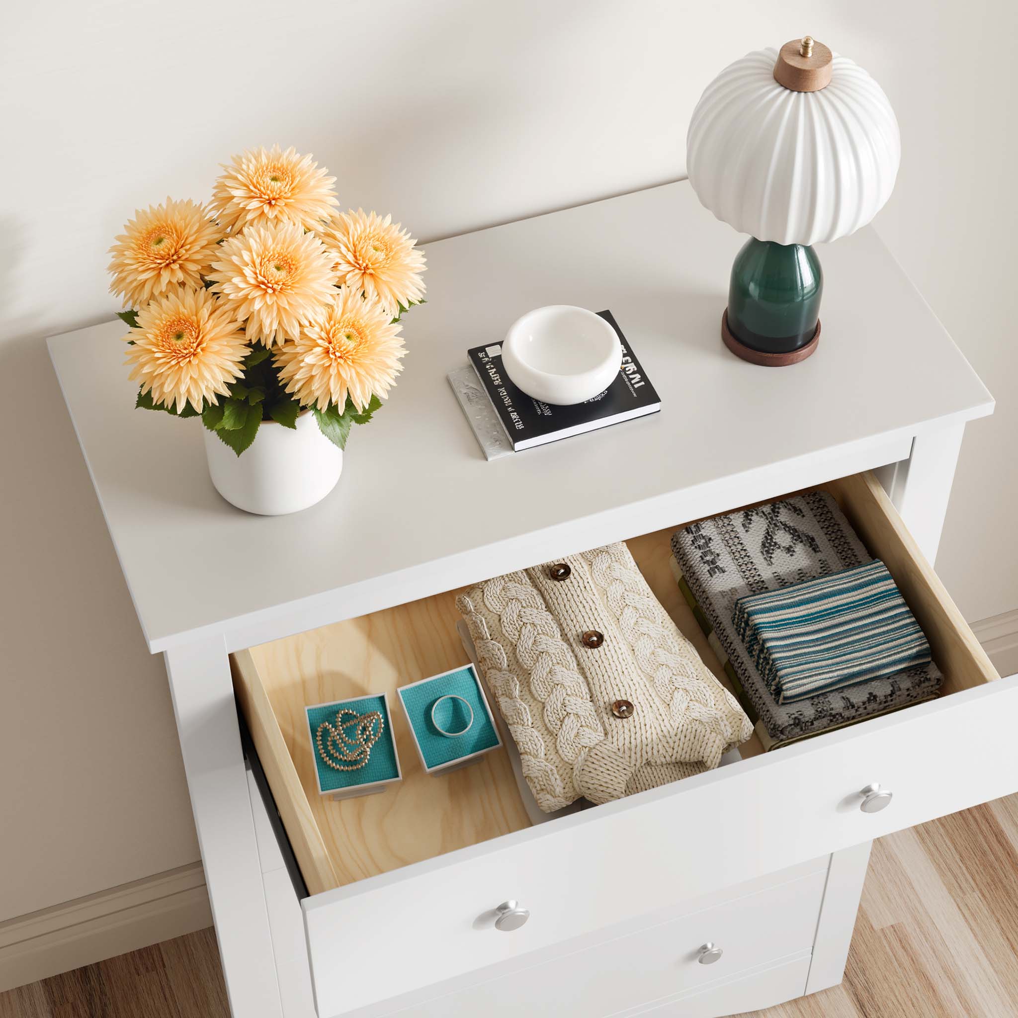 Top view of an open drawer in the White Treevan Hestia tall chest showing spacious storage for clothes and accessories.