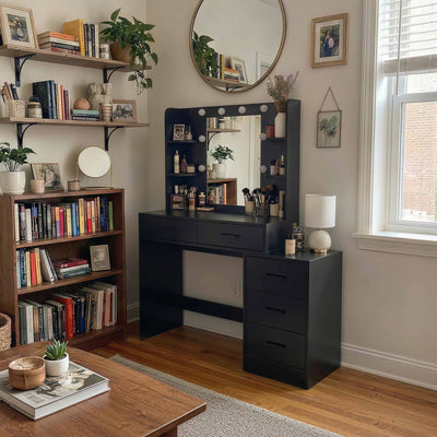Black Treevan Muse Suite Vanity desk used as a home office workspace in a cozy bedroom corner with bookshelves.