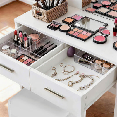 Close-up view of White Treevan Muse Vanity drawer storage space organized with cosmetics.